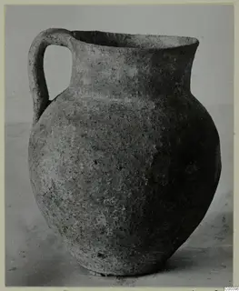 Coarse ware jug from the Kastros tombs at Lapithos, seen from the side against a plain background