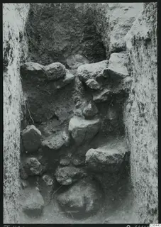 Tomb 420 at Lapithos Kastros during excavation, with stones filling the tomb chamber.