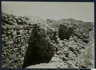 Stone walls and fallen rubble at Soli, the theatre, during excavation
