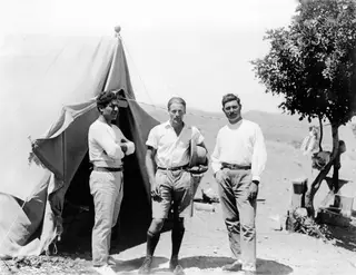 Kristos Giorgiou, Alfred Westholm and Lazaros Nikolaou standing outside a tent at Vouni