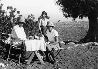 Breakfast laid on a table under a tree at Vouni, with John Lindros, Eleni and Alfred Westholm