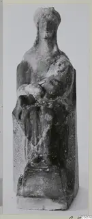 Seated figurine holding a small rounded object on its lap, from Vouni