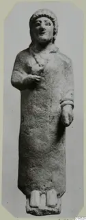 Limestone statue of a standing woman from Vouni, with one hand raised to the chest