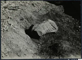 Worked stone fragment lying in an excavated trench at Vouni Palace