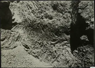 Excavation face at Plakes, Lapithos, with stones visible in the cut soil.