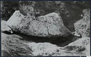 Large pale stone block lying in an excavated hollow at the palace at Vouni