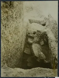 Narrow excavation trench at Vouni with loose stones lying in the cut