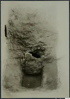 Excavated cutting at Vouni with a large stone block set against a vertical earth face