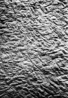 Close view of tool cuttings in the rock surface of Tomb 14 at Vouni.