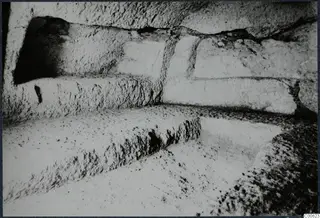 Rock-cut ledges and a recess in excavated stone at Vouni