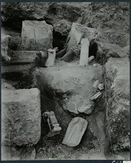 Statues and column drums lying in situ in an excavated room at Vouni