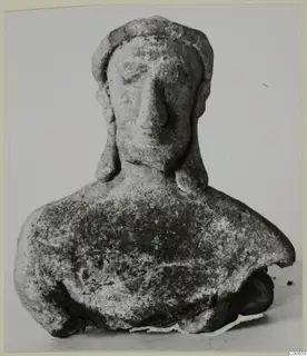 Terracotta bust figurine from Vouni with a close-fitting headdress and a large nose