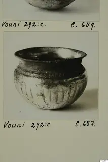 Silver vessel from Vouni with a flared rim and vertical lobed decoration on its body