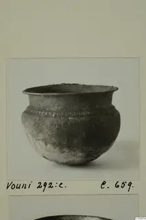 Dark grey vessel with a flaring rim and a band of impressed pattern below the rim, from Vouni