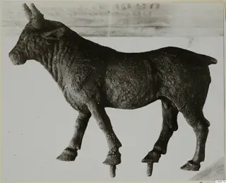 Bronze statuette of a standing horned animal from Vouni, shown in side view