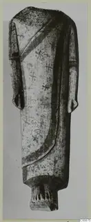 Limestone sculpture of a draped standing figure from Vouni, head missing