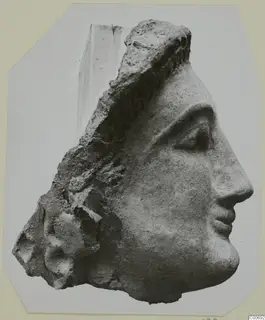 Terracotta head from Vouni, shown in profile facing right with a broken left side
