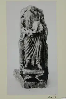 Limestone statuette of a seated figure holding a child on its lap, from Vouni
