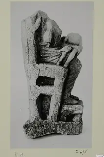 Limestone figurine of a seated figure with a small figure on its lap, from Vouni