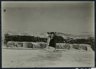 Theatre at Soli: stone wall with a gap spanned by a timber beam during excavation