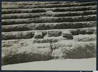Stepped tiers at the theatre at Soli, with two small stone blocks set into a middle row