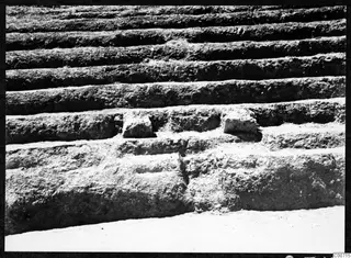 Stone steps of the theatre at Soli, cut into the ground with two loose stone blocks set into the treads.
