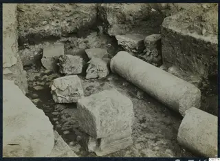 Excavated trench at Soli with carved stone capitals and column drums lying on the ground