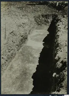Excavation trench at Soli with soil and stones along its sides