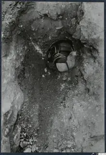 Gold treasure in situ in a small hollow in the ground in Room 59 at Vouni