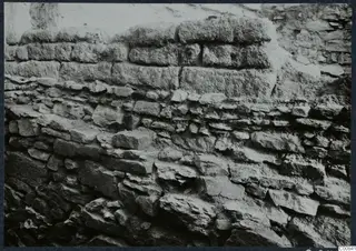 Close view of a stone wall at Idalion Acropolis, with large upper blocks over smaller, irregular stones below.