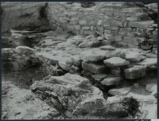 Excavated stone wall and fallen stone blocks at Idalion Acropolis