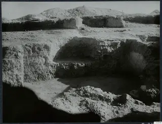 Excavation on the Acropolis at Idalion, with exposed walls and loose rubble in the trench