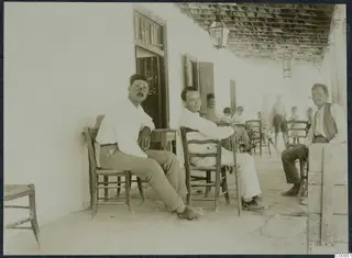 Erik Sjöqvist, Lazaros and Giorkos seated on a whitewashed veranda at Idalion.