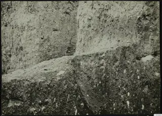 Excavated soil face at Plakes, Lapithos, with stones set in the earth