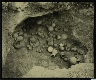 Tomb 702 at Lapithos, interior with pottery vessels lying in situ on the chamber floor