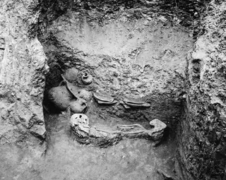 Tomb 602 at Lapithos, interior with a skeleton and pottery vessels lying in situ.