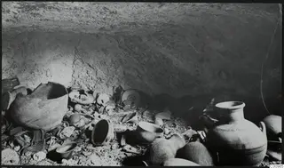 Tomb 428 at Lapithos Kastros, chamber interior with pottery vessels and sherds lying in situ