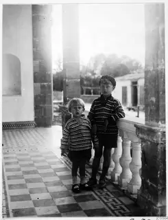 Stefan Gjerstad and Martin Gjerstad standing on a tiled veranda beside stone pillars, Nicosia