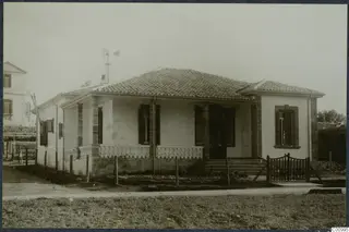 The Swedish house at Nicosia, a white single-storey house with a tiled roof and a veranda