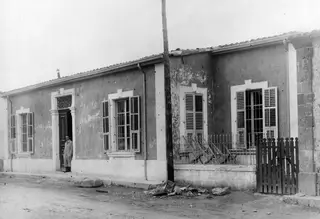 Swedish Institute building in Nicosia, with a man standing in the doorway