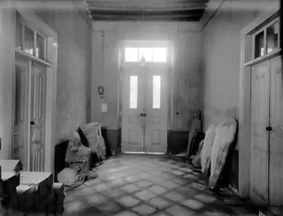 Interior of the Swedish Institute at Nicosia with stone sculptures standing against the walls and on the tiled floor