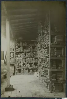 Storage room at the Swedish Institute, Nicosia, with wooden shelves stacked with boxes