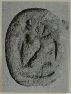 Oval scarab-shaped seal with a carved design on its flat face