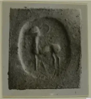 Glyptic from Vouni: a seal design with an animal and an upright figure within an oval field