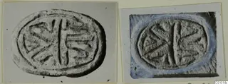 Two photographs of an oval stone seal impression with an incised design of a central bar and radiating strokes