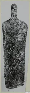 Corroded bronze scraper from the Vrysi tou Barba tombs at Lapithos, shown from the front