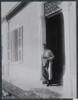 Alfred Westholm standing in the doorway of a whitewashed building, Nicosia