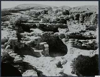 Excavated ruins on the Acropolis at Idalion, with low walls and stone foundations among rubble.
