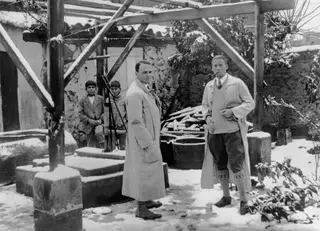 Erik Sjöqvist and Alfred Westholm standing in the snowy courtyard of the Swedish Institute, Nicosia