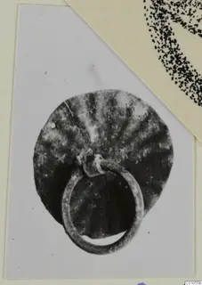 Bronze disc with radiating ridges and a loop attached at its lower edge, from Idalion